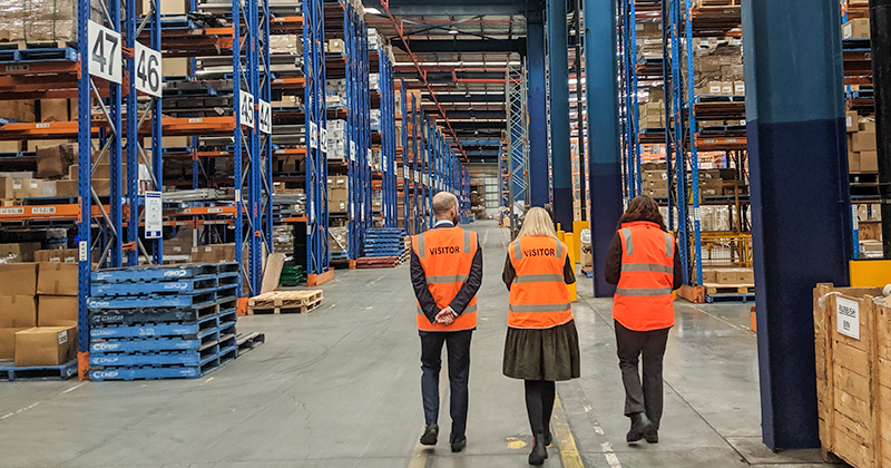 Three uTenant employees in a warehouse