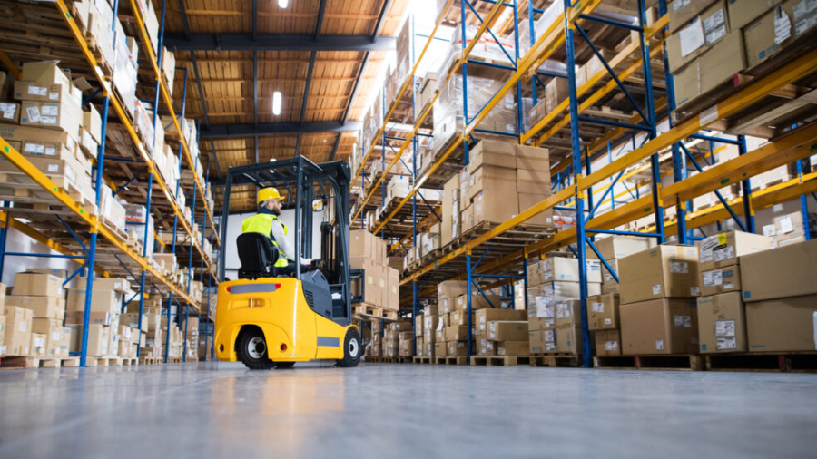 Person operating forklift in a warehouse